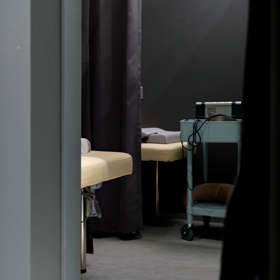 A quiet treatment room with two curtained beds at DEAR Korean Medicine Clinic in Seoul