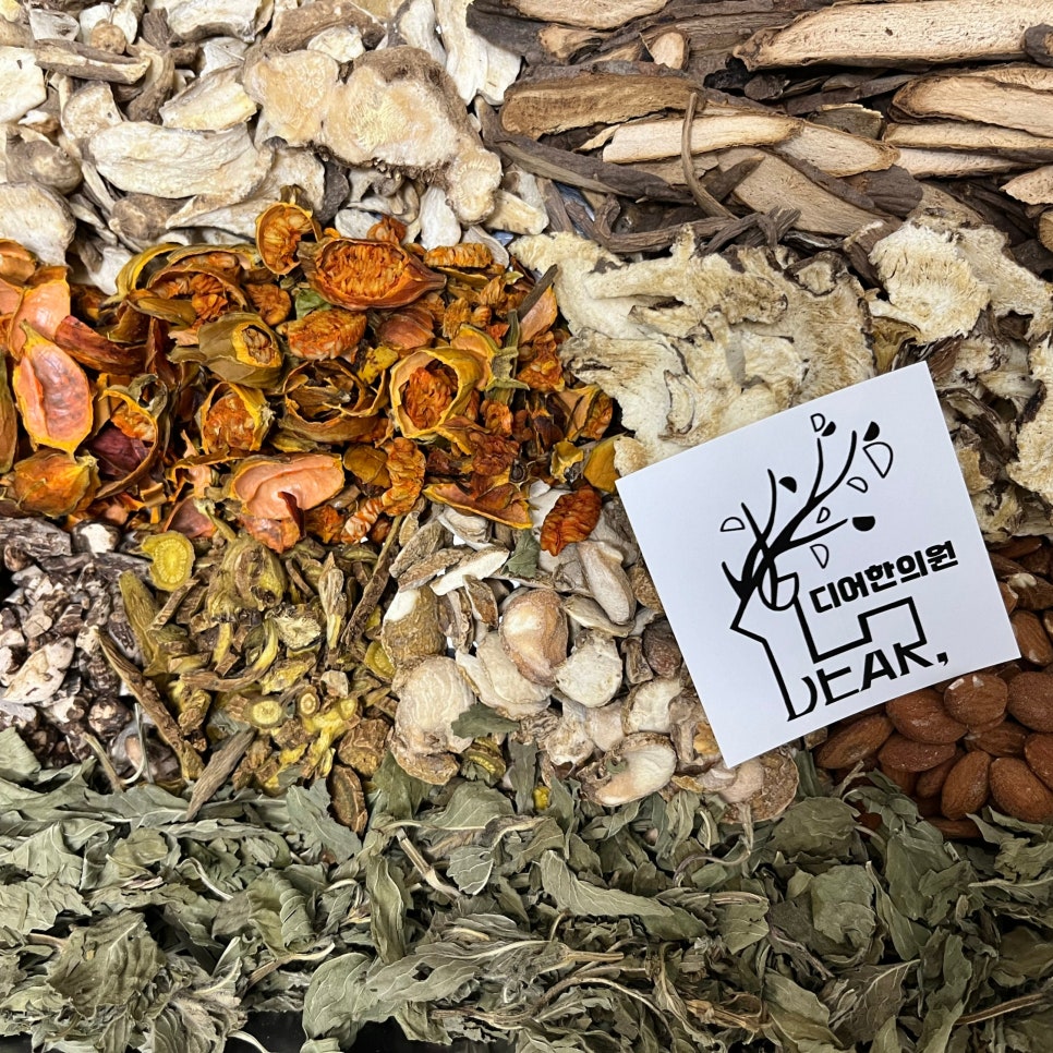 Dried herbs laid out beside a DEAR card